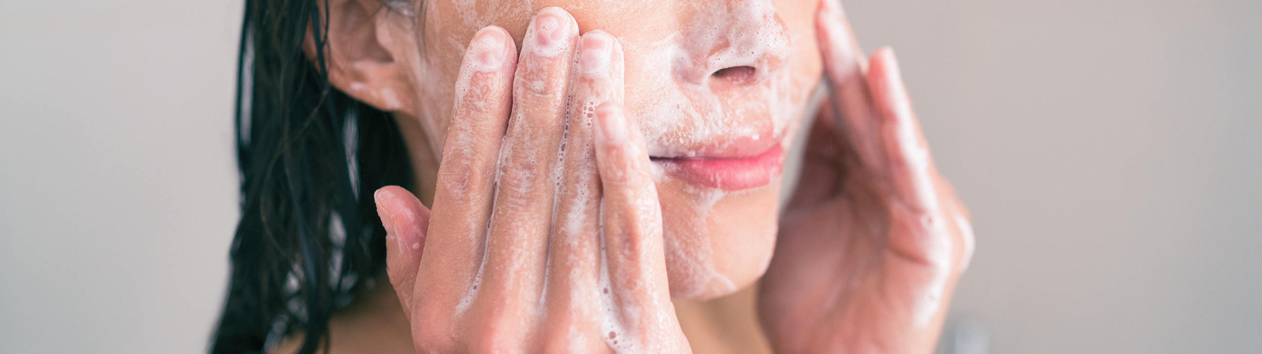 Woman washes face